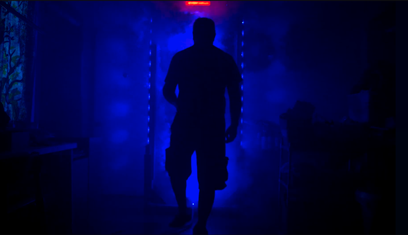 Cinematic silhouette in a blue-lit doorway